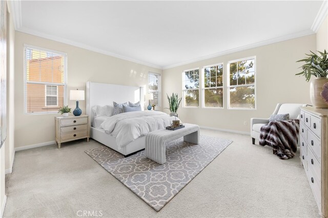 bedroom featuring light colored carpet and ornamental molding