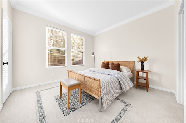 bedroom featuring ornamental molding and light carpet