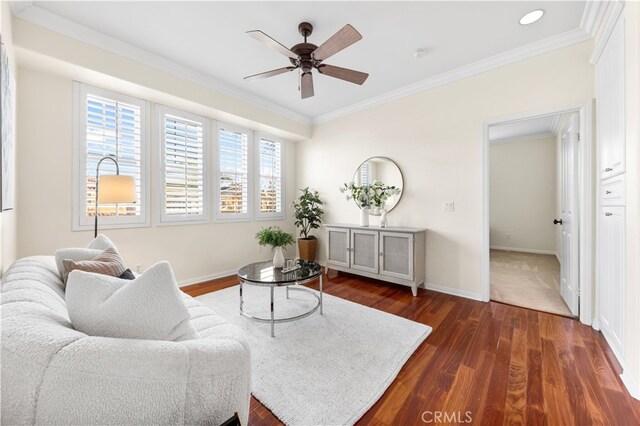 living room featuring ornamental molding, dark hardwood / wood-style floors, and ceiling fan