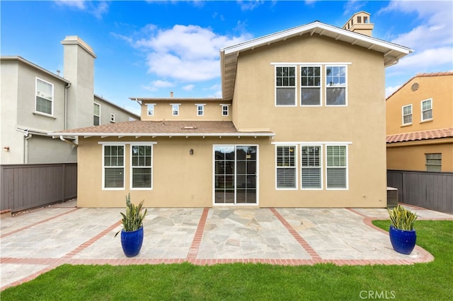 rear view of house with a patio