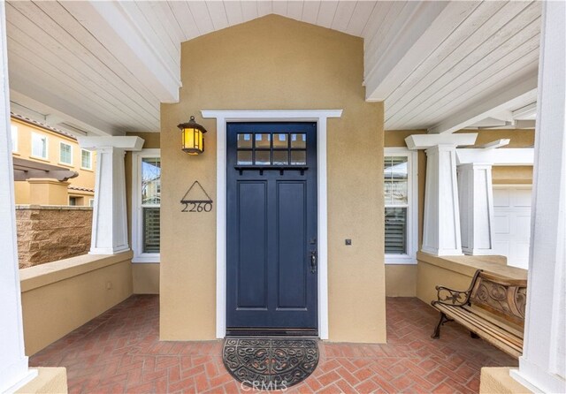 doorway to property with a porch