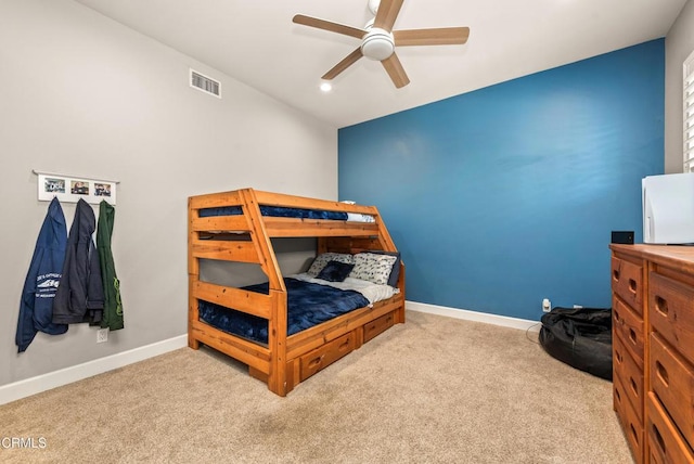 carpeted bedroom with ceiling fan