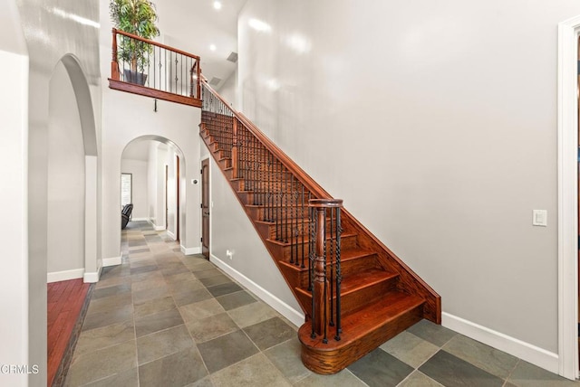 stairway with a towering ceiling