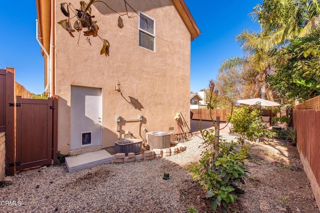 view of home's exterior featuring cooling unit and a patio area