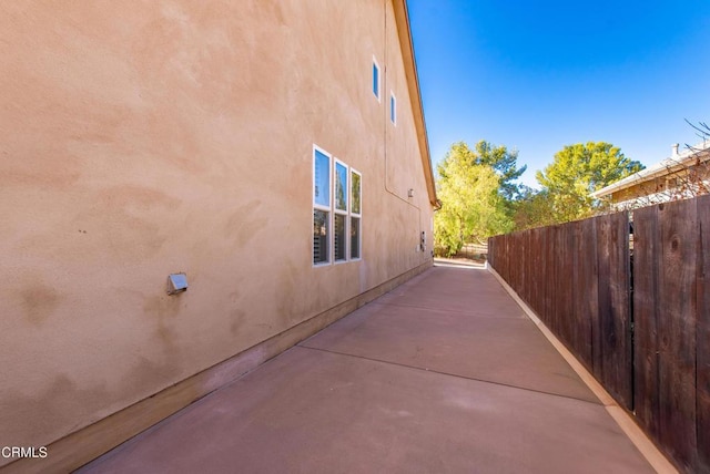 view of side of property featuring a patio area