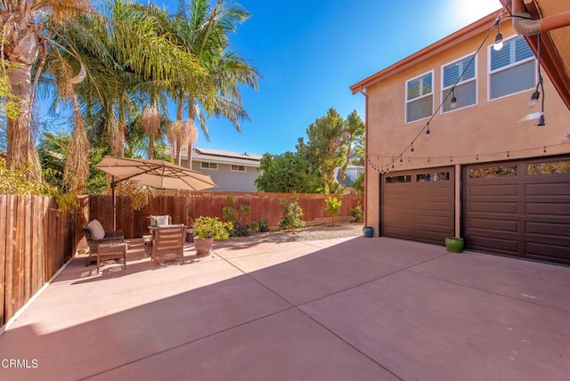 exterior space with a garage and a patio area