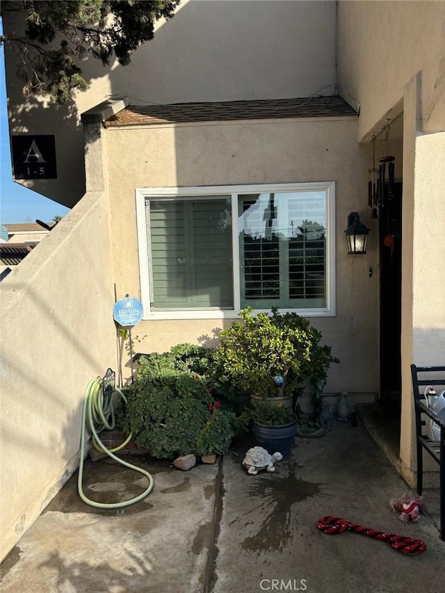 view of side of home with a patio area