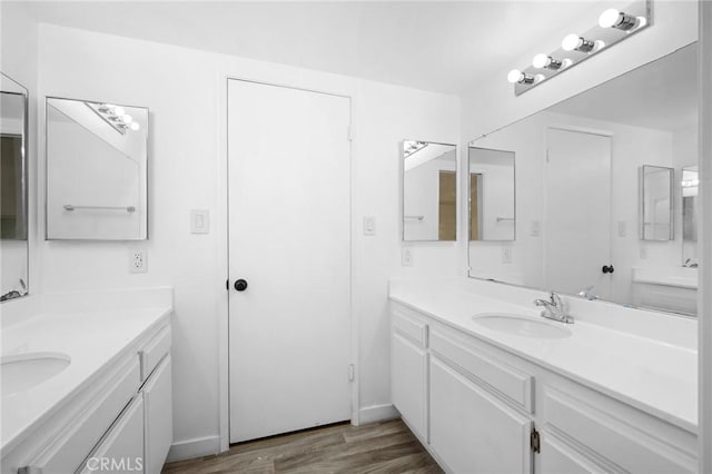 bathroom with wood-type flooring and vanity