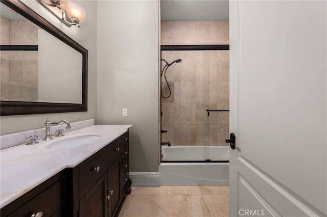 bathroom with enclosed tub / shower combo, vanity, and tile patterned floors