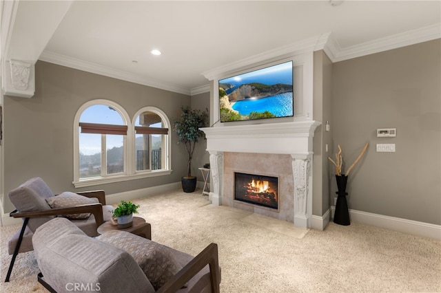 living room with a tile fireplace, ornamental molding, and light carpet