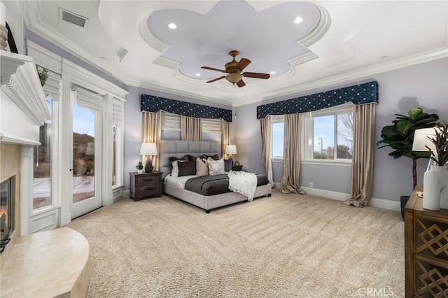 bedroom featuring carpet floors, access to outside, ceiling fan, a raised ceiling, and crown molding