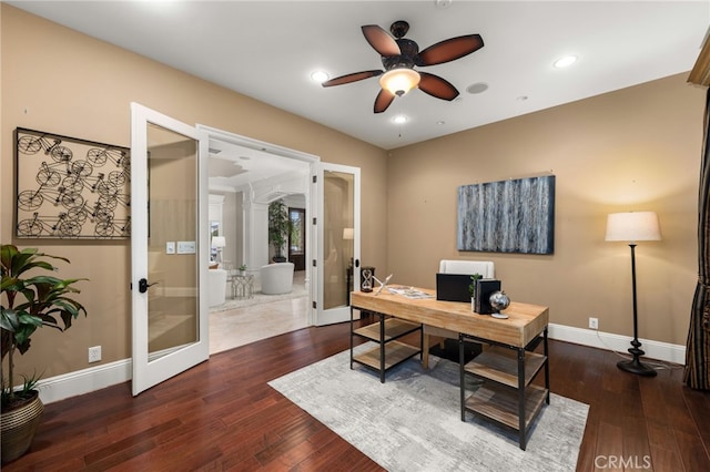 office space featuring french doors, ceiling fan, and dark wood-type flooring