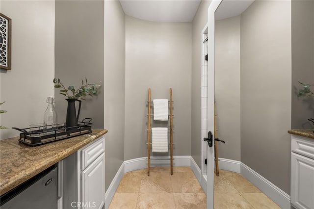 bathroom with tile patterned flooring and vanity