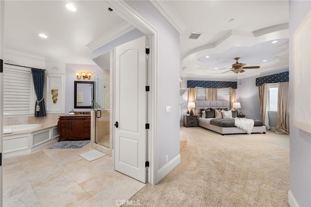carpeted bedroom with ornamental molding and connected bathroom