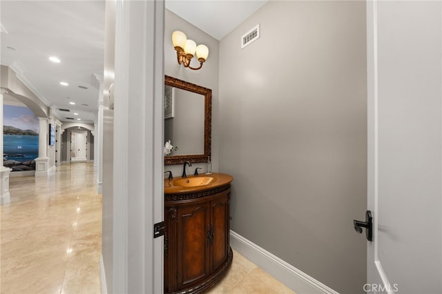 corridor with sink and ornate columns