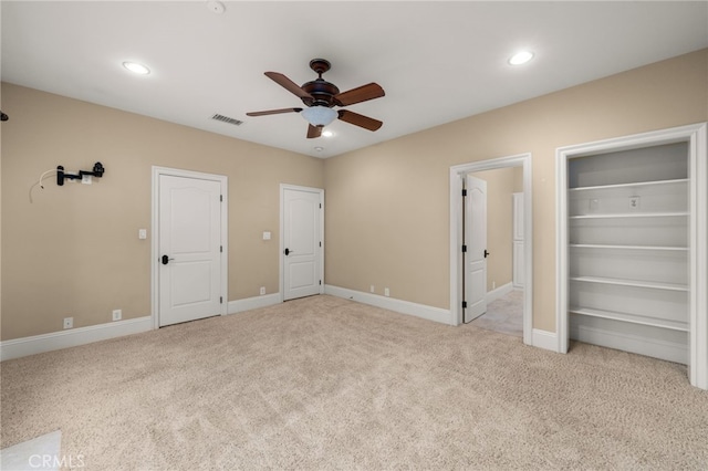 unfurnished bedroom with light carpet and ceiling fan