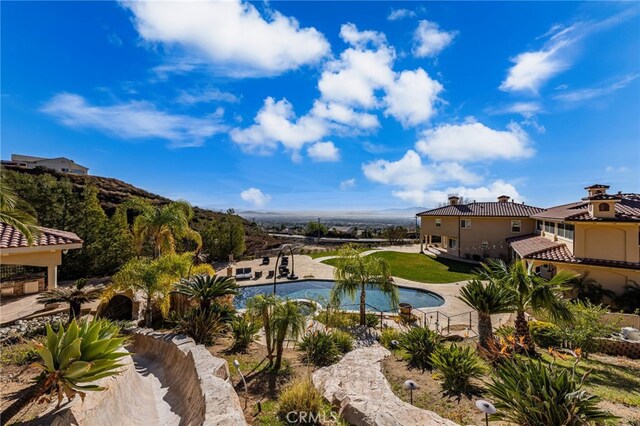 view of swimming pool with a patio