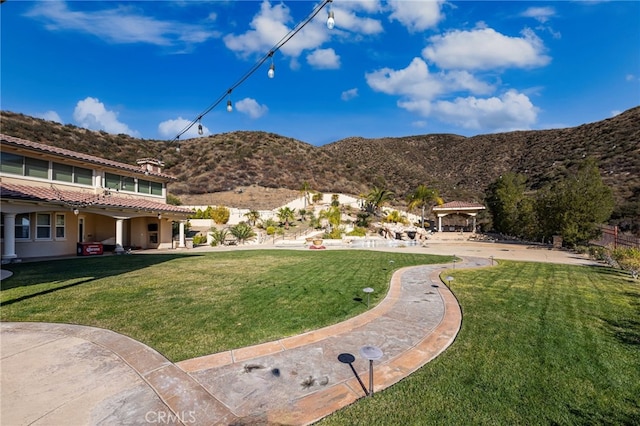 view of yard with a mountain view