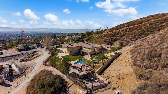 birds eye view of property with a mountain view