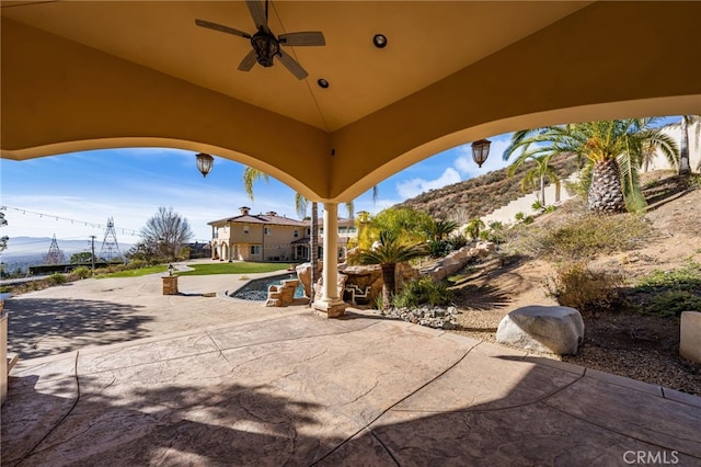view of patio featuring ceiling fan