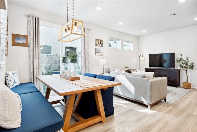 living room with light hardwood / wood-style flooring