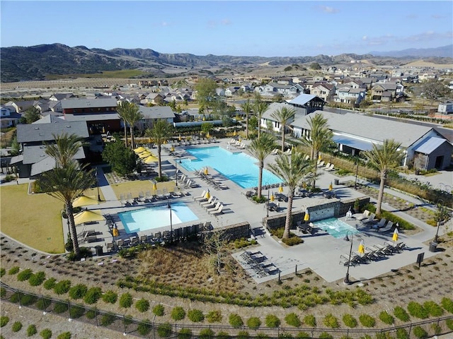 birds eye view of property featuring a mountain view