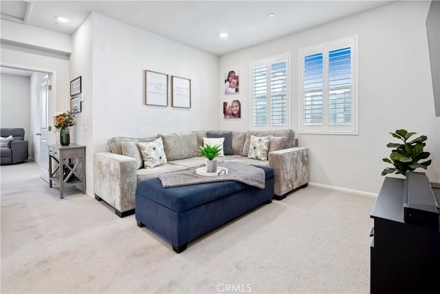 living room featuring light carpet