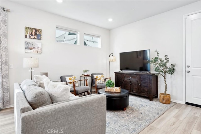 living room with light hardwood / wood-style floors