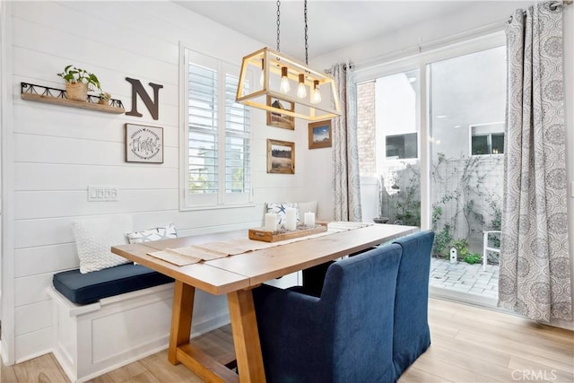 dining area with breakfast area and light wood-type flooring