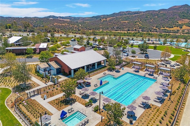 birds eye view of property with a mountain view