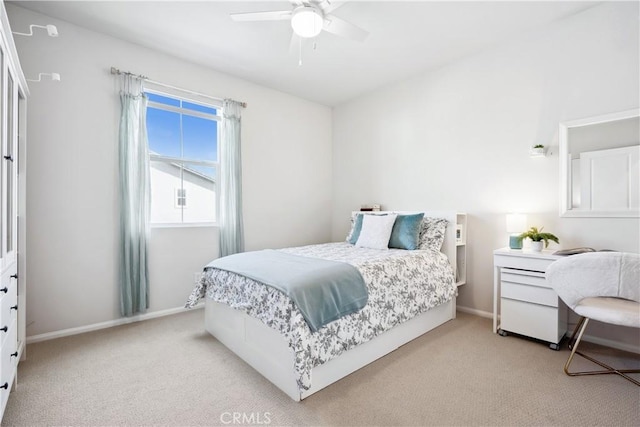 bedroom with light colored carpet and ceiling fan