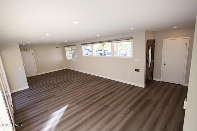 empty room with dark wood-type flooring