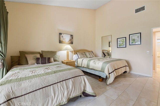 bedroom featuring light tile patterned floors