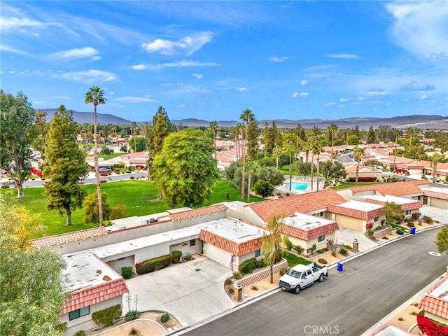 birds eye view of property with a mountain view