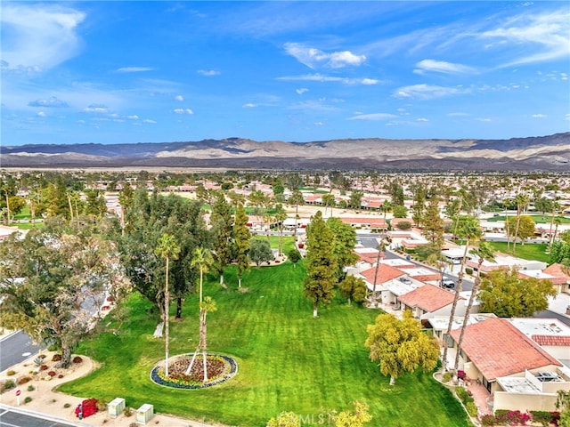 birds eye view of property featuring a mountain view