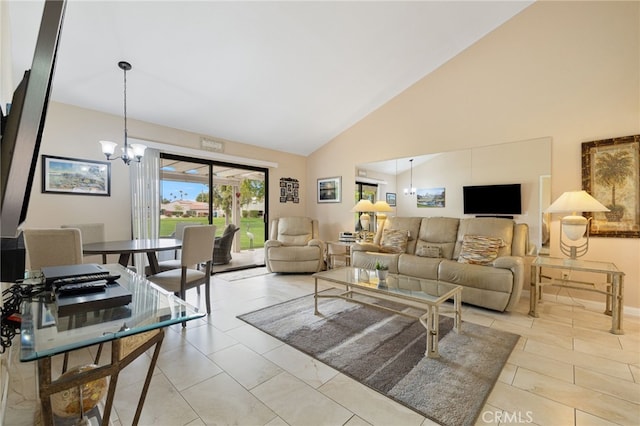 living room with high vaulted ceiling, light tile patterned floors, and an inviting chandelier