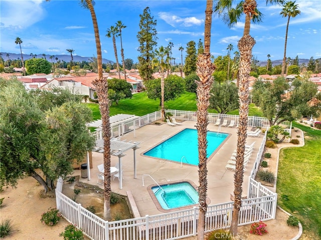 view of pool with a hot tub and a patio area