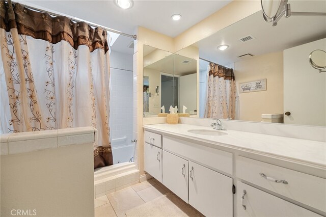 bathroom with vanity and tile patterned floors