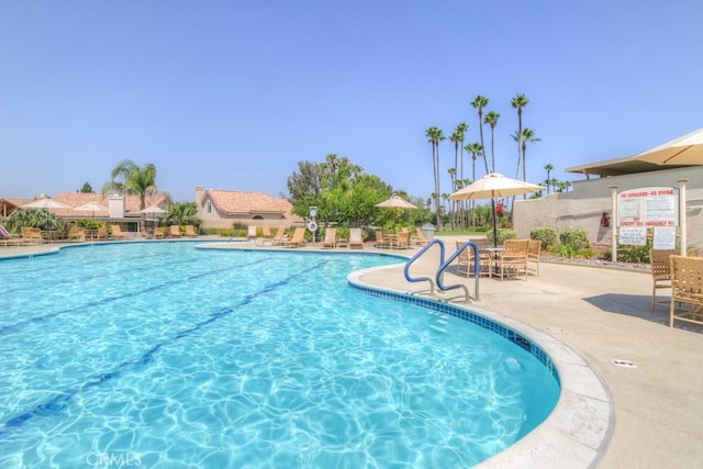 community pool with a patio