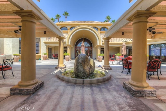 view of community with a patio and outdoor dining space