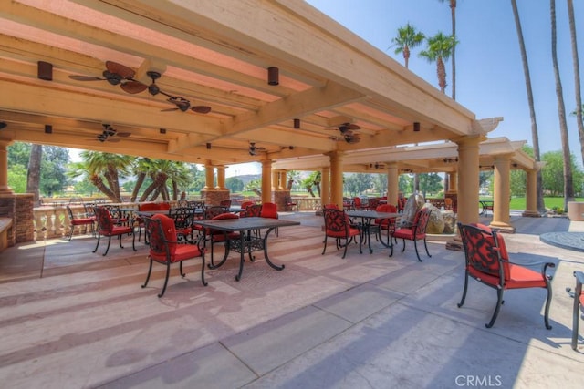 view of patio featuring a gazebo and outdoor dining area