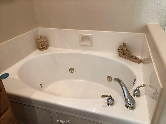 bathroom featuring a whirlpool tub