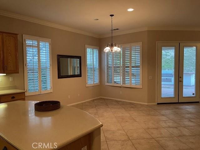5467 Breckenridge Ave, Banning, CA 92220 - unfurnished dining area with light tile patterned floors, a chandelier, french doors, crown molding, and recessed lighting