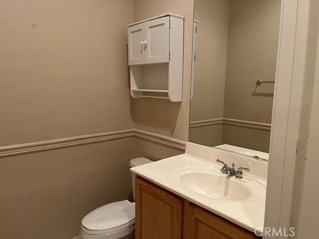 5467 Breckenridge Ave, Banning, CA 92220 - half bathroom with vanity and toilet
