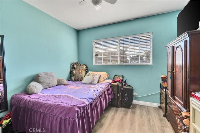 bedroom with ceiling fan and light hardwood / wood-style floors