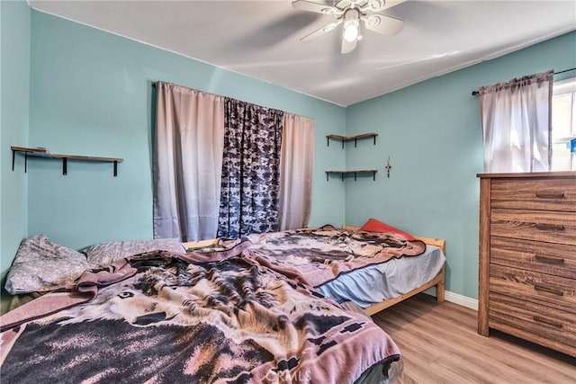 bedroom featuring ceiling fan and light hardwood / wood-style flooring