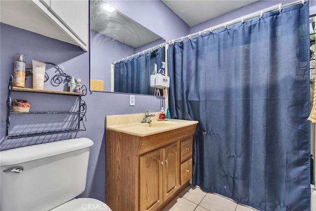 bathroom featuring tile patterned flooring, vanity, a shower with curtain, and toilet