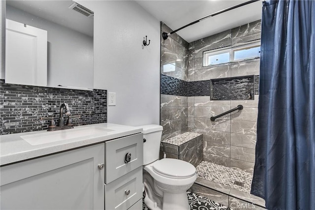 bathroom featuring toilet, a shower with shower curtain, vanity, and decorative backsplash