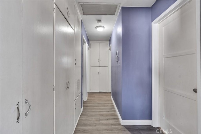 hall with light hardwood / wood-style floors