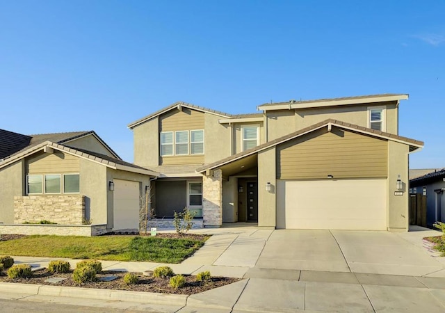 view of front of home with a garage